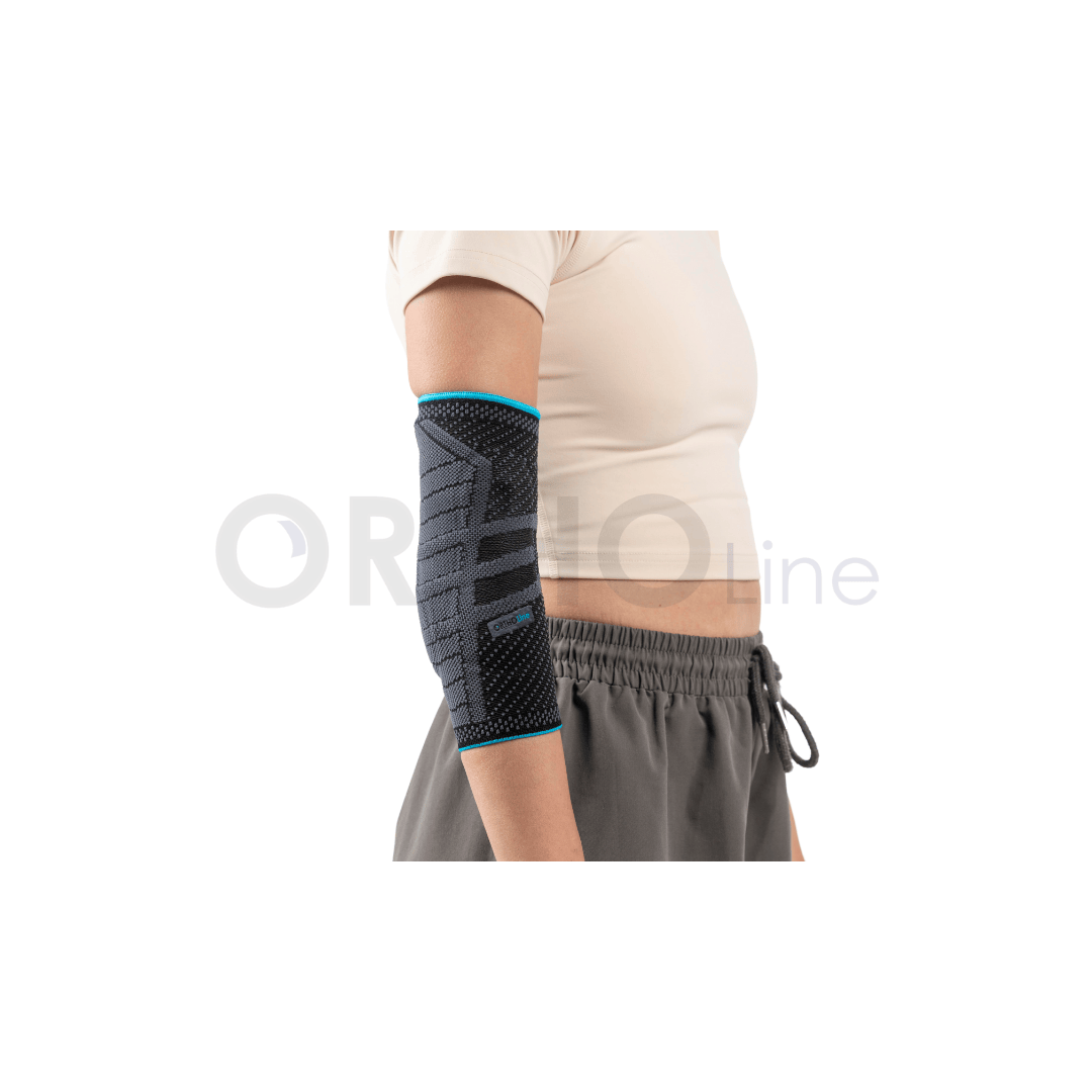 Cureline - women using Ortholine elbow brace back view