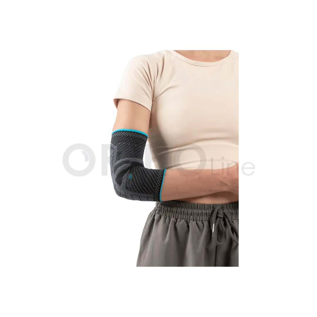 Cureline - women using Ortholine elbow brace side view